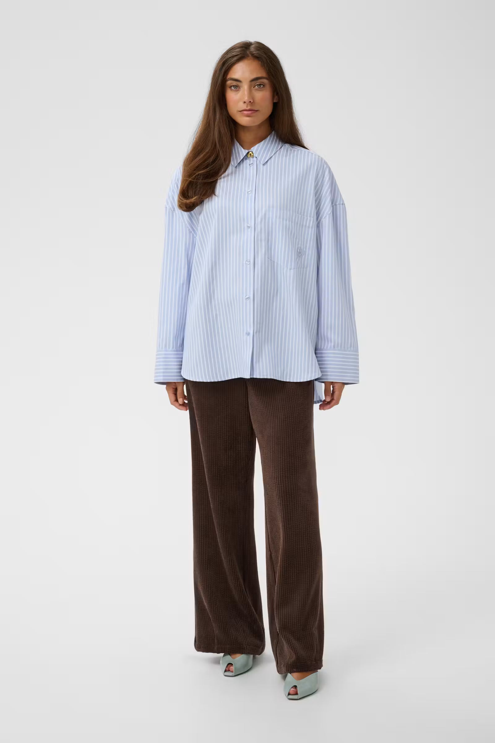Culture Manga blue and white stripe shirt styled with brown trousers