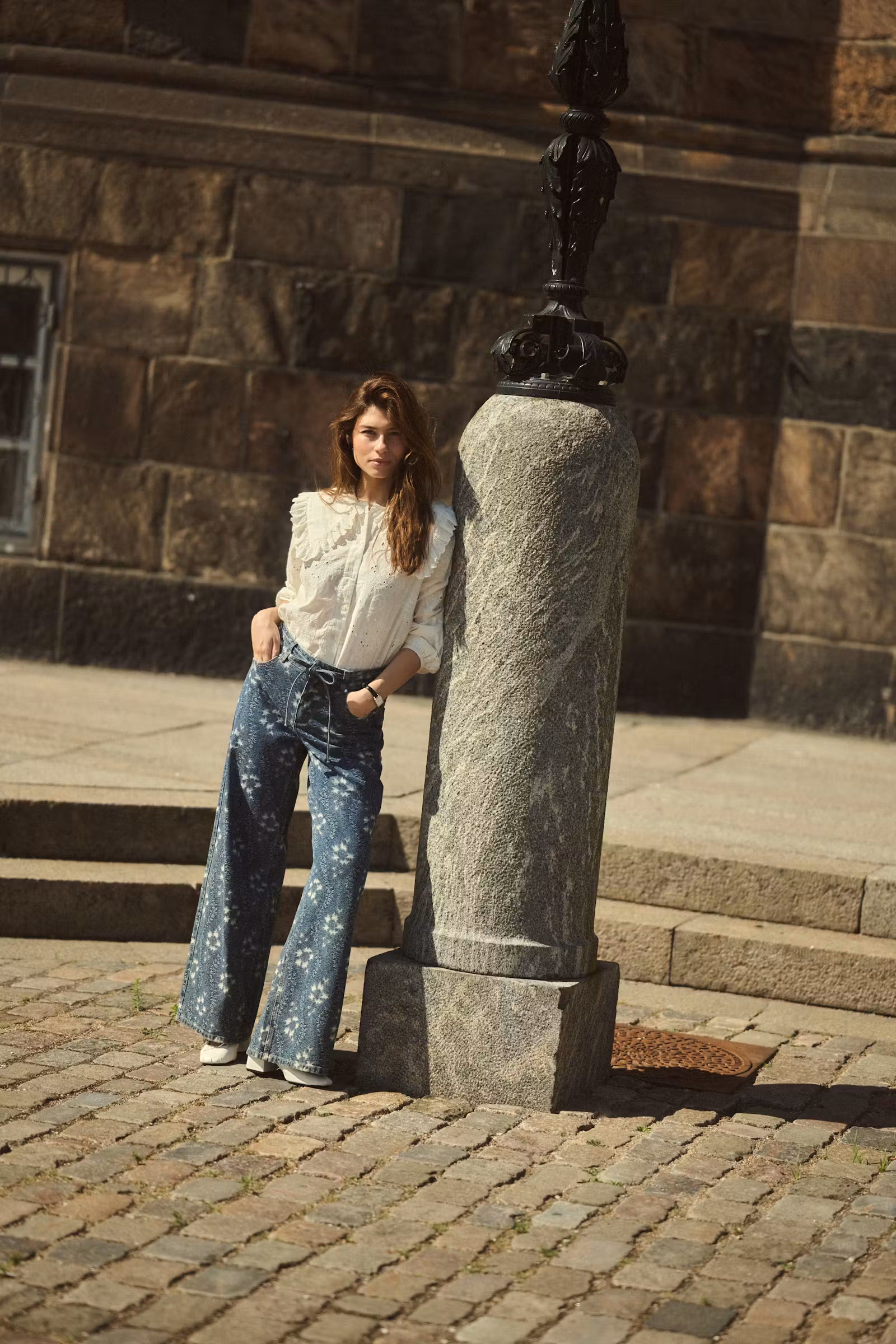 Culture Claramille statement collar blouse styled with embroidered wide leg jeans