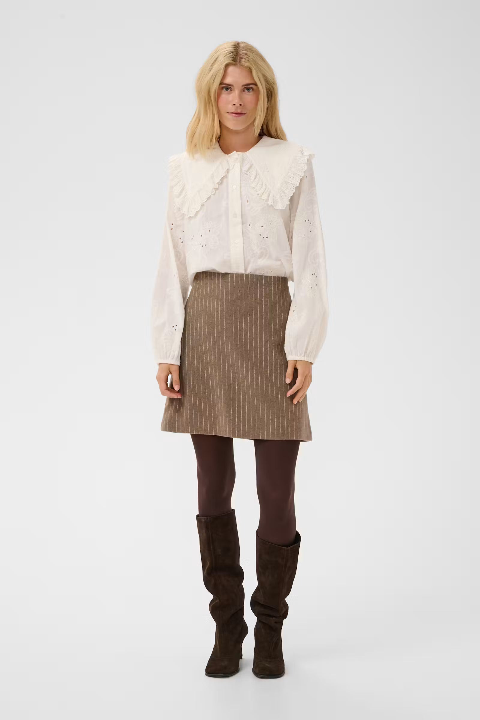 Culture Claramille ivory statement collar blouse styled with taupe mini skirt