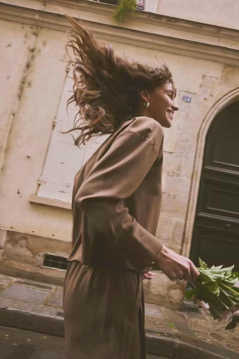 Side view of Fransa Veda brown wide leg trousers styled outdoors