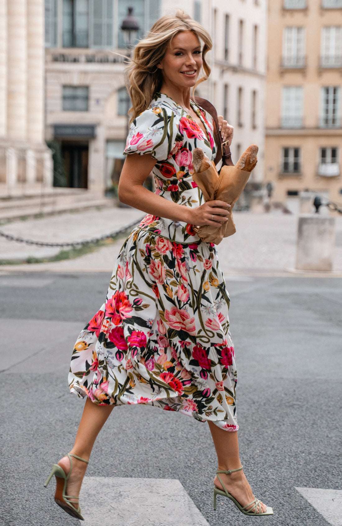 Hope & Ivy Angie tiered floral midi dress shown in motion outdoors