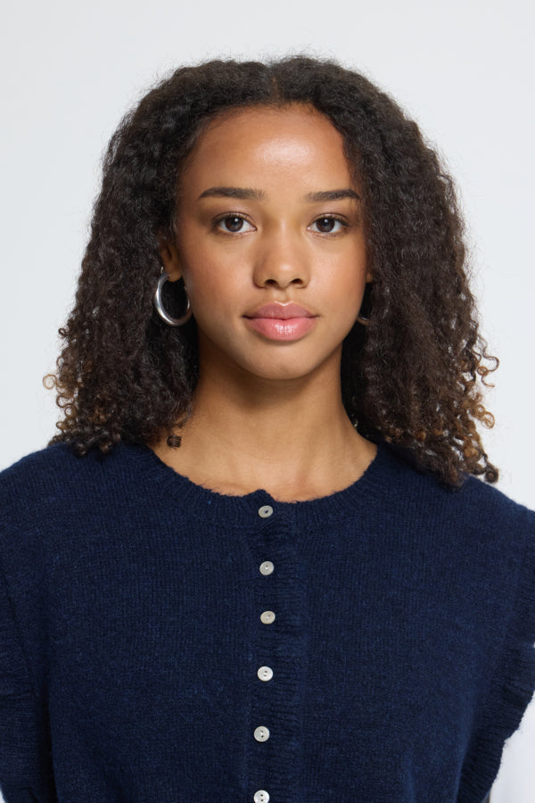 Close-up of ICHI Povoke navy knitted waistcoat round neckline and button front