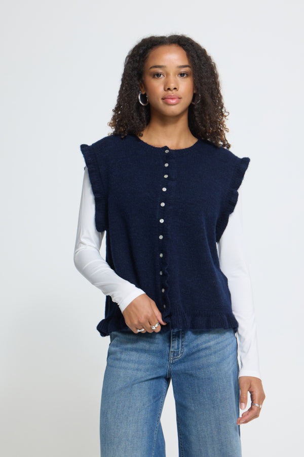 ICHI Povoke Total Eclipse navy knitted waistcoat layered over a white long sleeve top