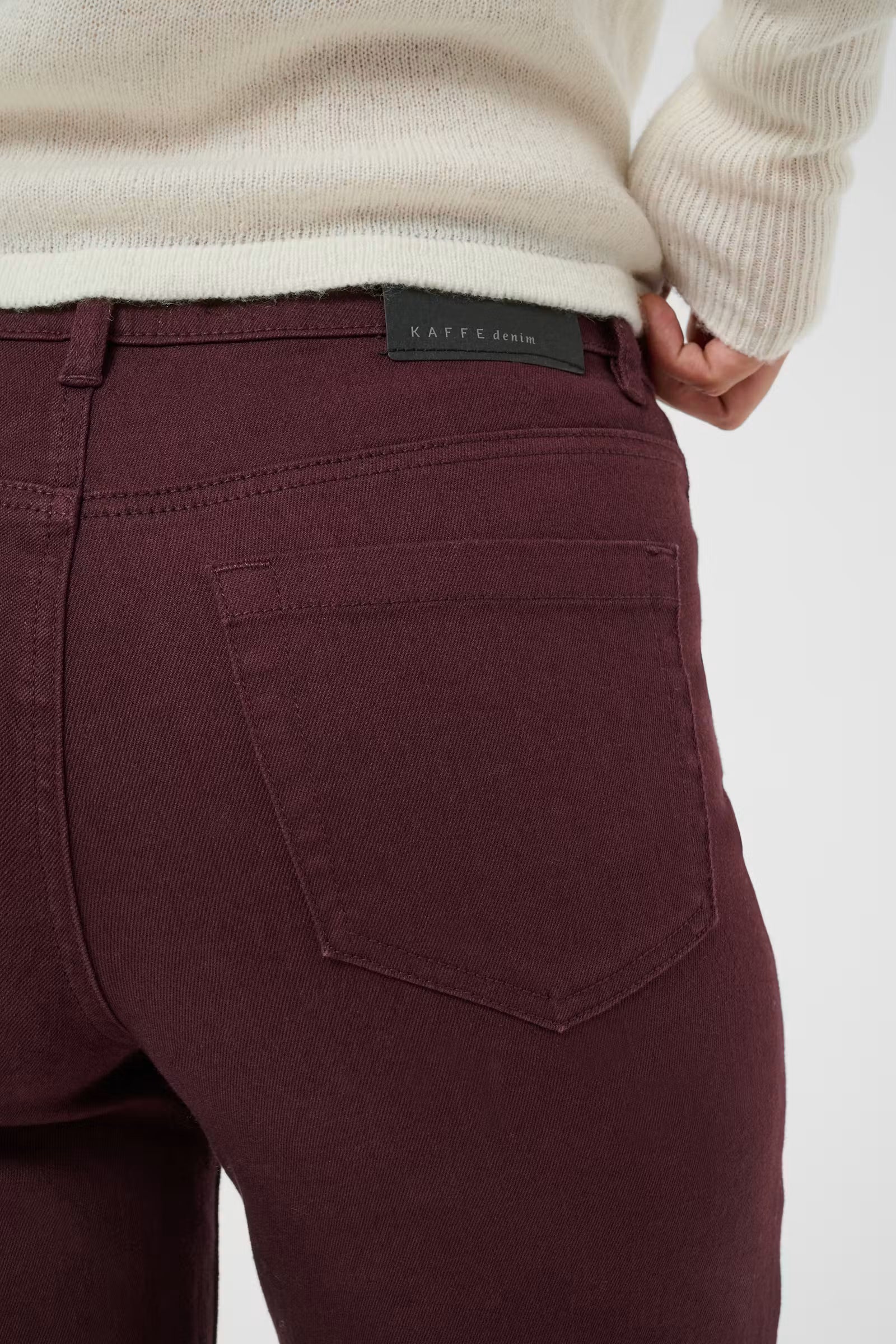 Close-up of Kaffe Brook burgundy straight leg jeans back pocket detail