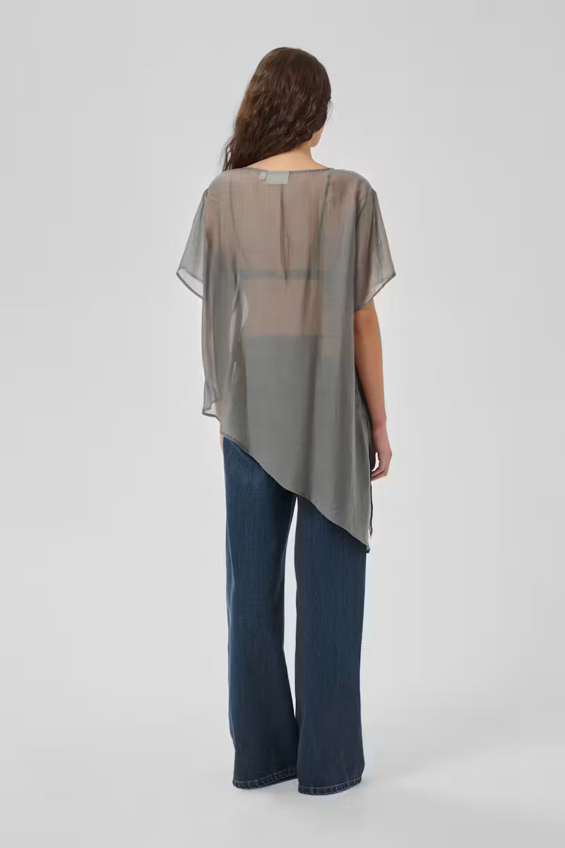 Back view of My Essential Wardrobe Smilla grey sheer short sleeve asymmetric top