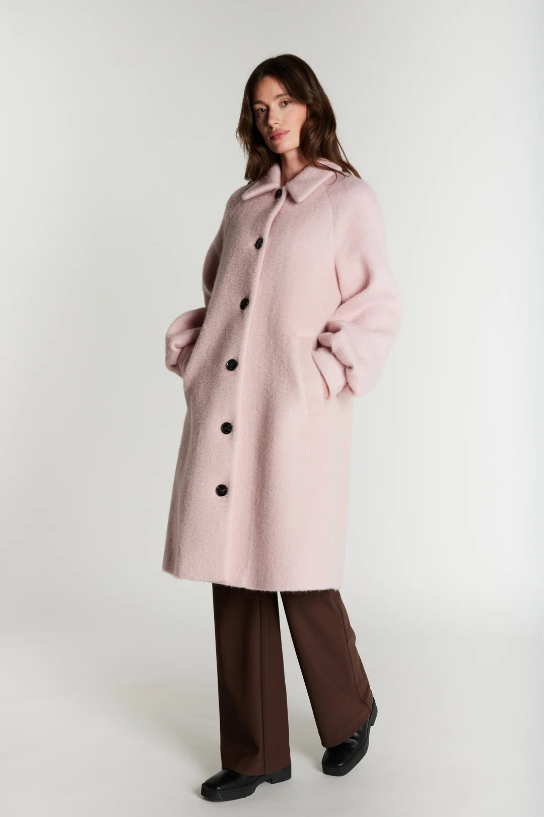 Rue de Femme Addison blush pink coat styled with hands in pockets