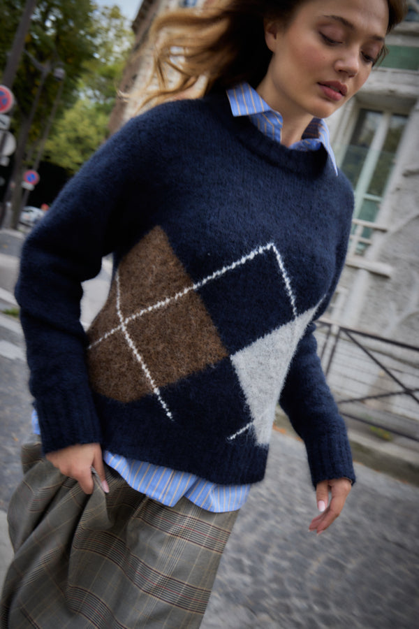 ICHI Bayana navy argyle jumper layered over a blue shirt outdoors