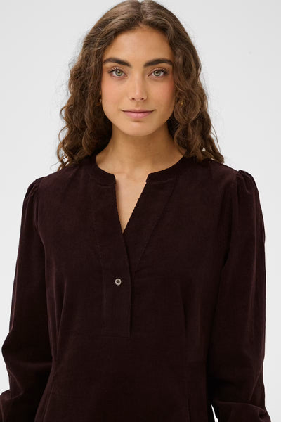 Close-up of Culture Rhaena dark brown corduroy dress split neckline
