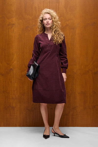 Culture Rhaena burgundy knee length dress styled with black clutch