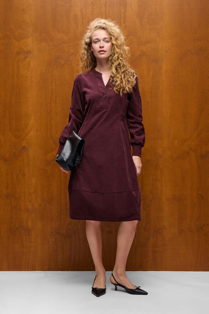 Culture Rhaena burgundy knee length dress styled with black clutch