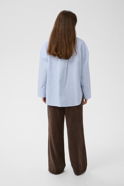 Back view of Culture Manga blue and white oversized long sleeve shirt
