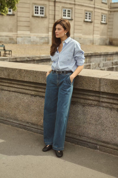 Culture Manga blue striped shirt styled outdoors with blue jeans
