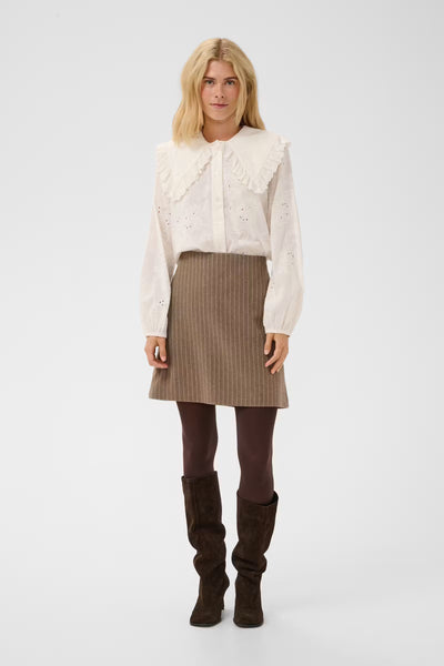 Culture Claramille ivory statement collar blouse styled with taupe mini skirt
