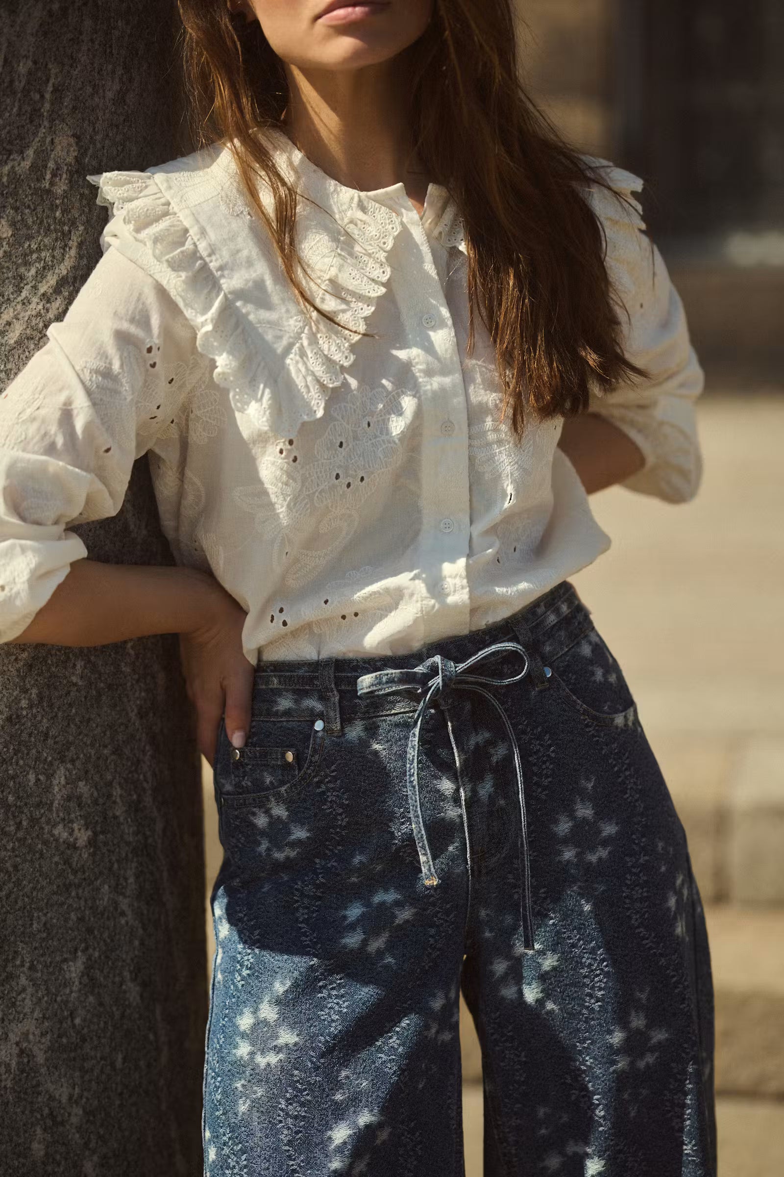 Culture Claramille ivory embroidered blouse styled with blue jeans outdoors