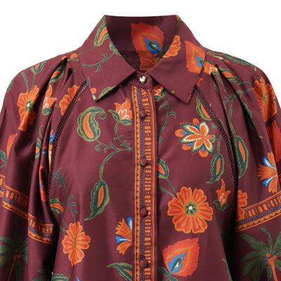 Close-up of Emily Lovelock Alisha burgundy floral blouse collar and contrast trim