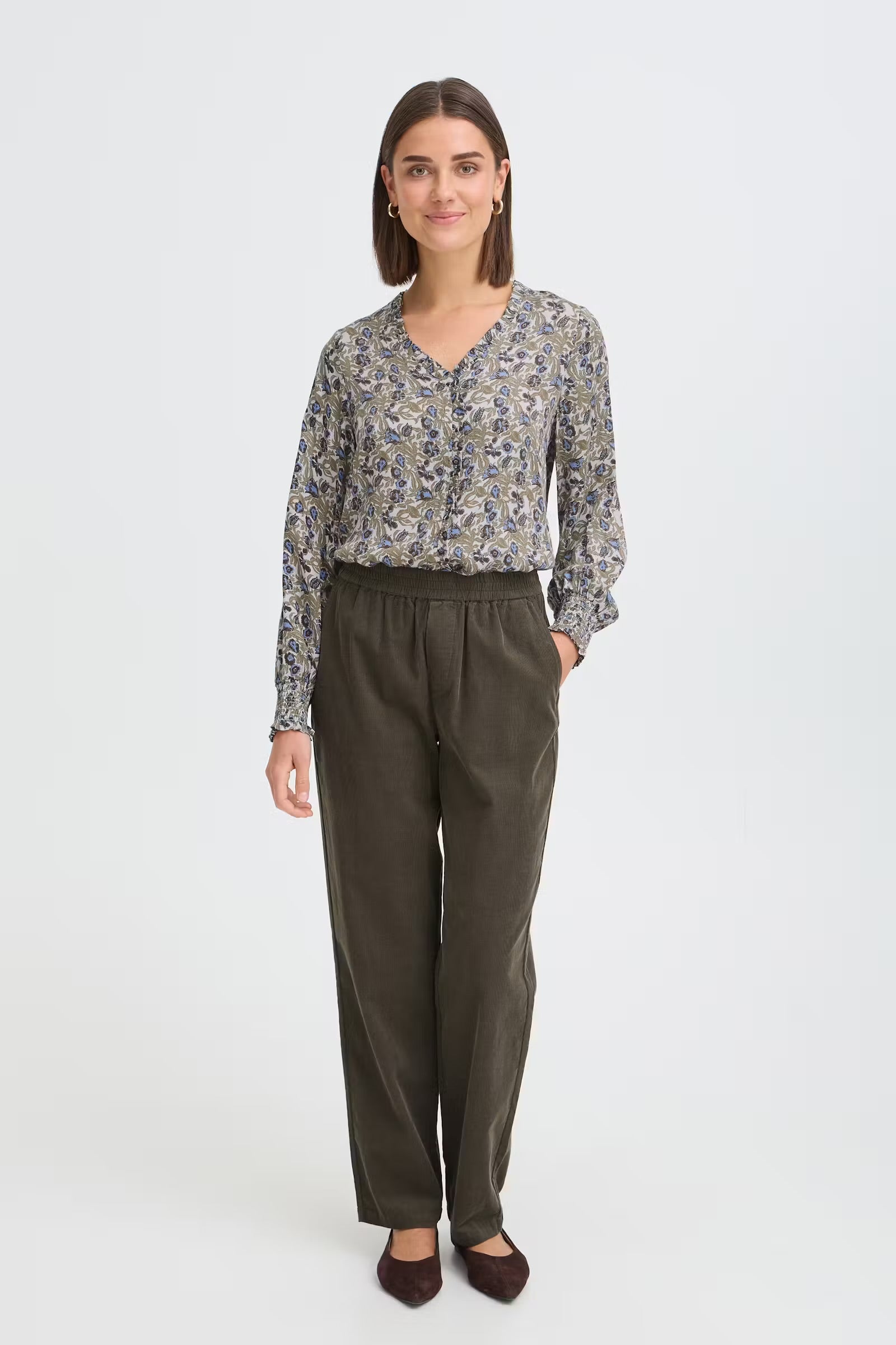 Fransa Gladis olive green floral blouse styled with dark trousers