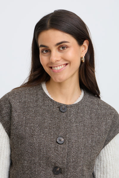 Close-up of Fransa Vea brown herringbone waistcoat round neckline and buttons