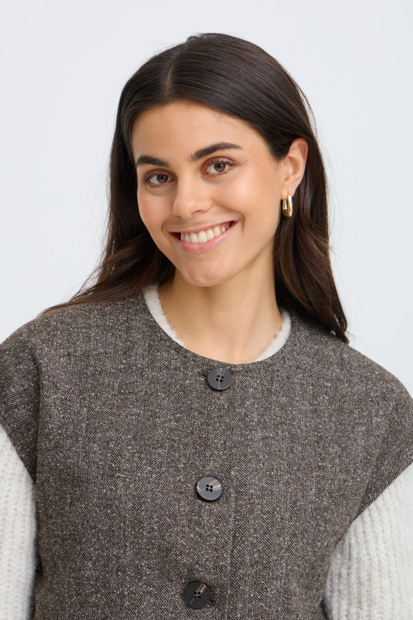 Close-up of Fransa Vea brown herringbone waistcoat round neckline and buttons