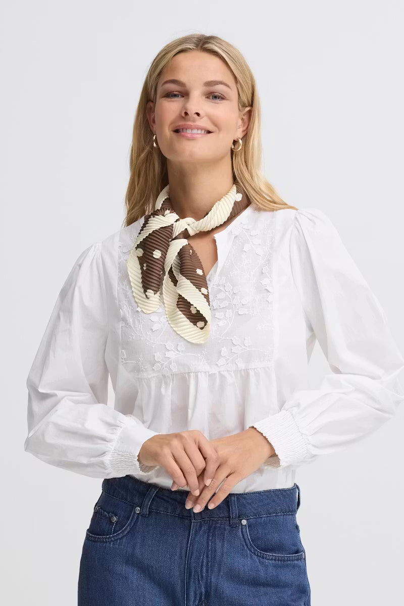 Fransa Selana brown pleated neck scarf styled with a white blouse front view