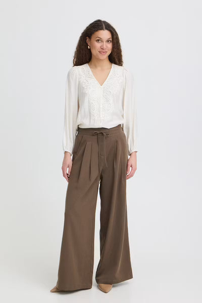 Fransa Veda brown wide leg trousers styled with a cream blouse front view