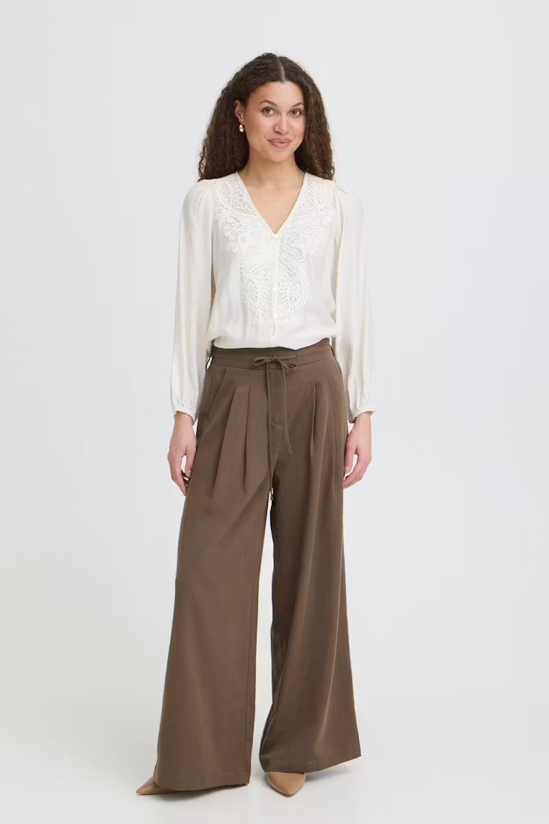 Fransa Veda brown wide leg trousers styled with a cream blouse front view