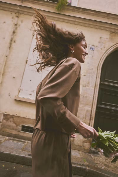 Side view of Fransa Veda brown wide leg trousers styled outdoors