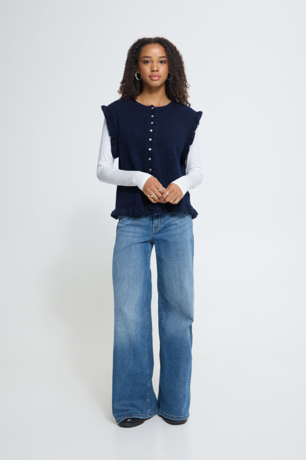 ICHI Povoke Total Eclipse sleeveless knit waistcoat styled with blue jeans