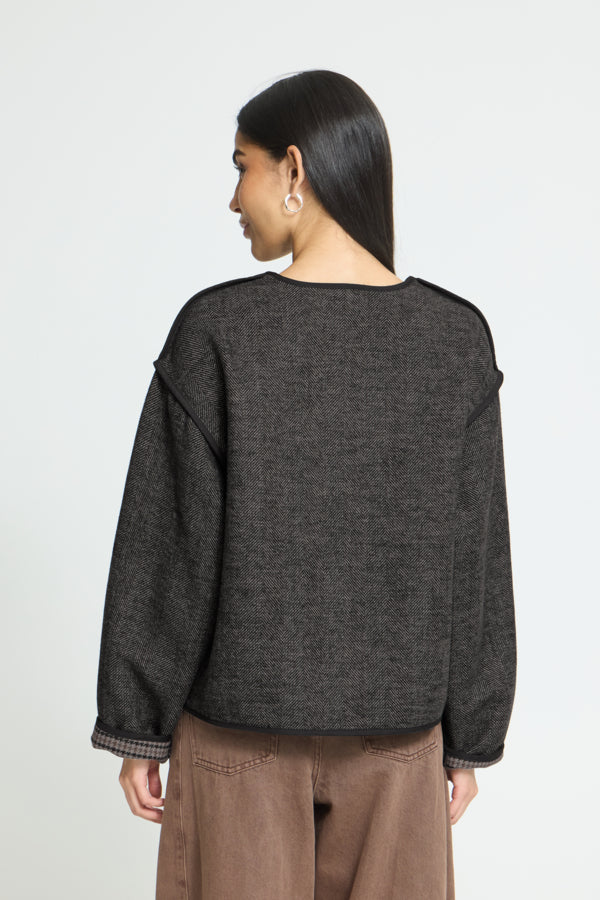 Back view of ICHI Frava black boxy herringbone jacket