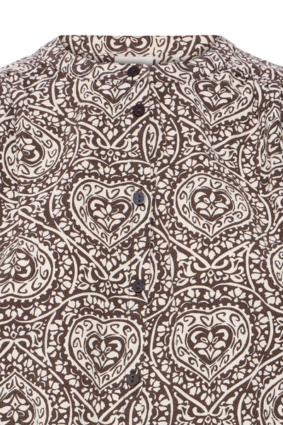 Close-up of ICHI Katilio folklore heart motif in brown and birch