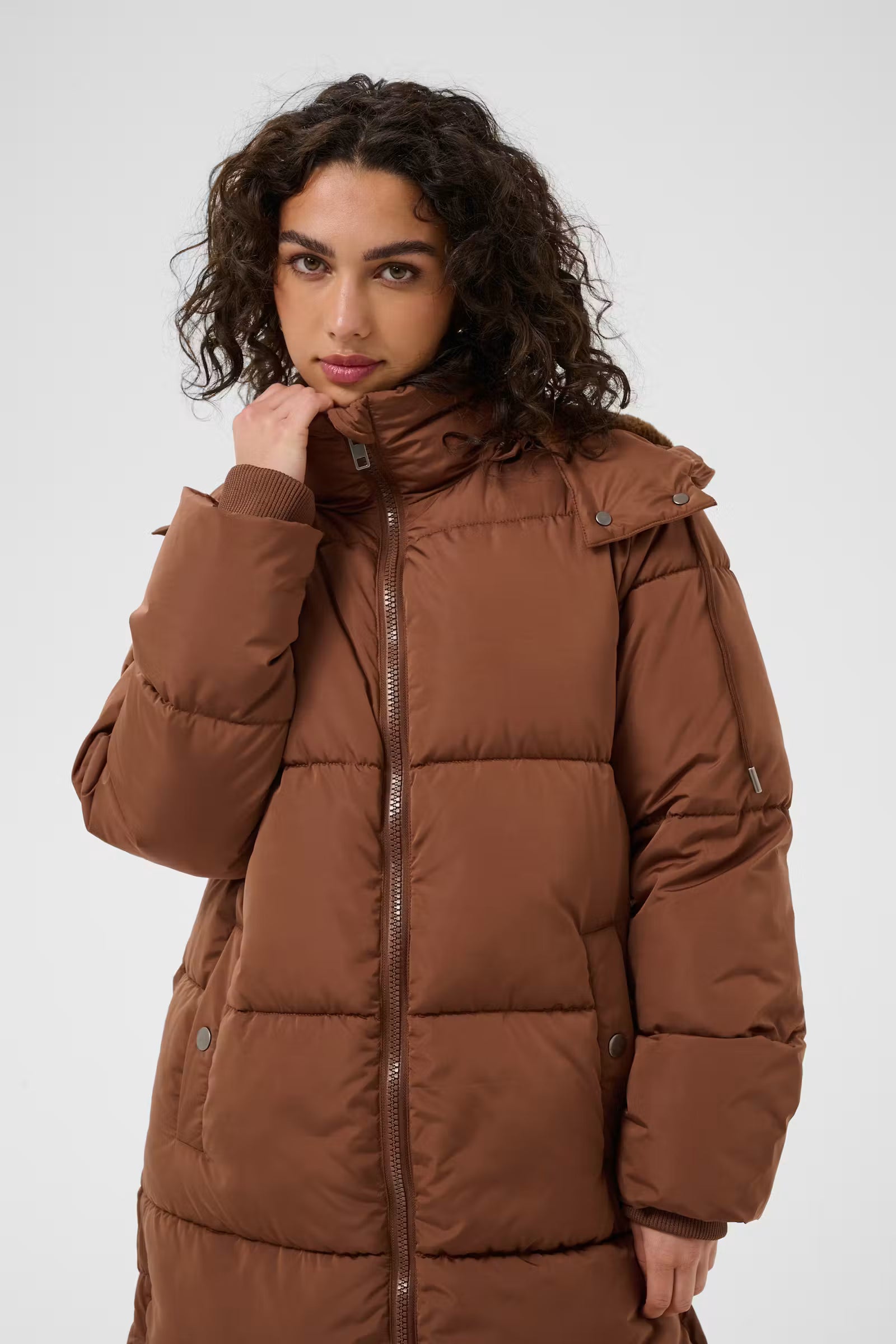 Close-up of Kaffe Nikalui brown padded coat drawstring hood and high neckline
