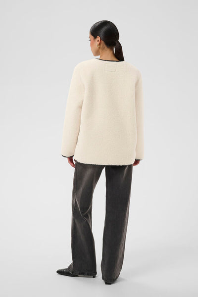 Back view of Kaffe Sandra Turtledove teddy jacket with black trim