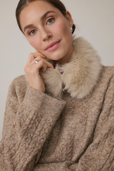 Close-up of Kaffe Melanie beige cable knit jumper neckline and texture