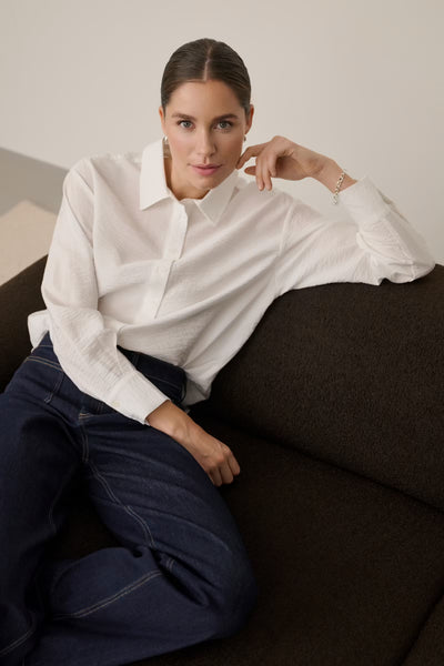 Kaffe Gilda white long sleeve bow shirt styled with navy trousers