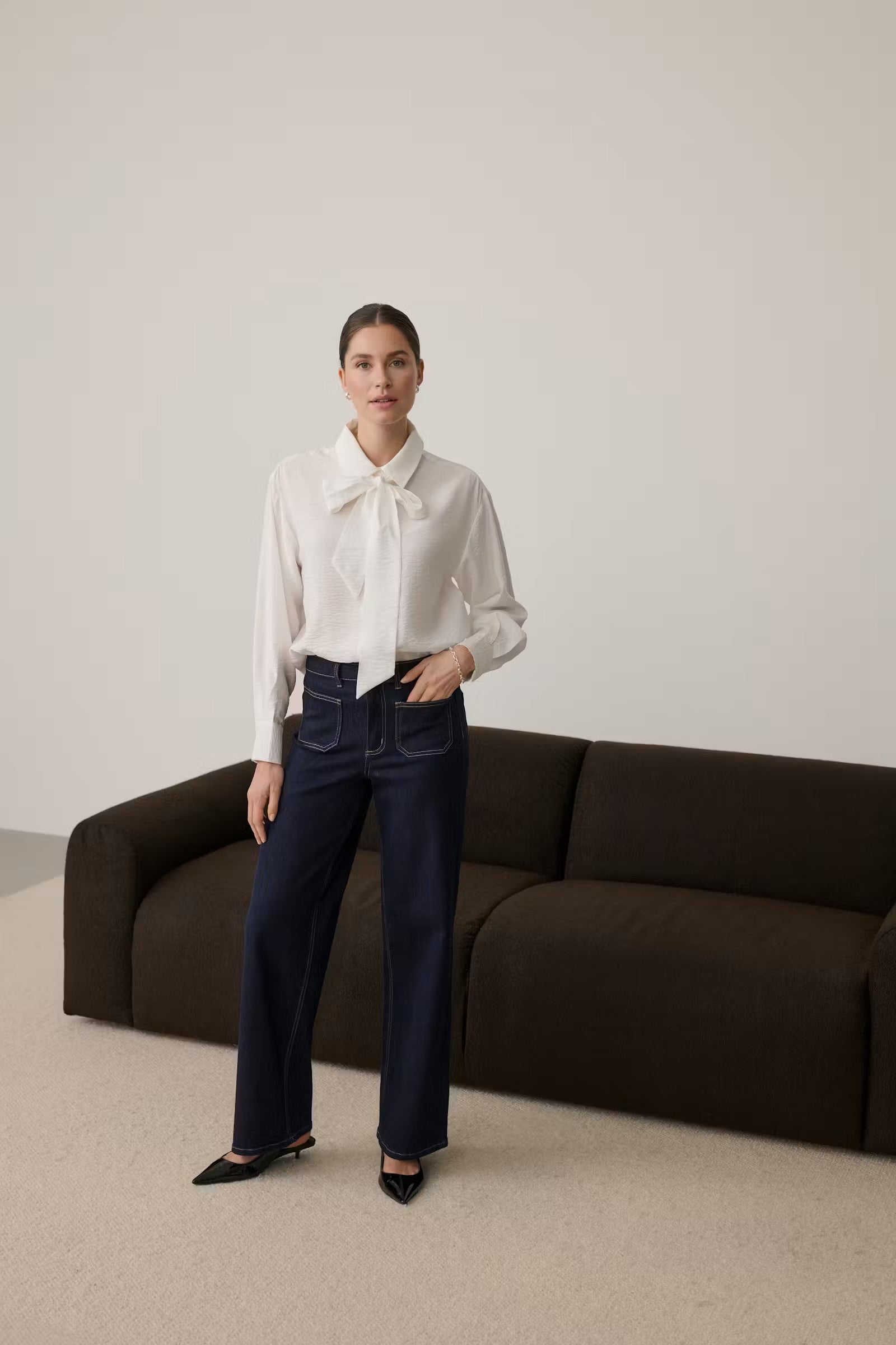 Full-length view of Kaffe Gilda chalk white tie-neck blouse