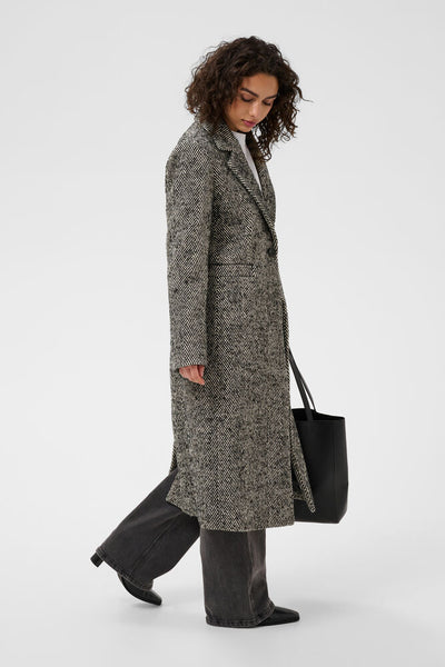 Kaffe grey herringbone mid-calf coat side view with black trousers