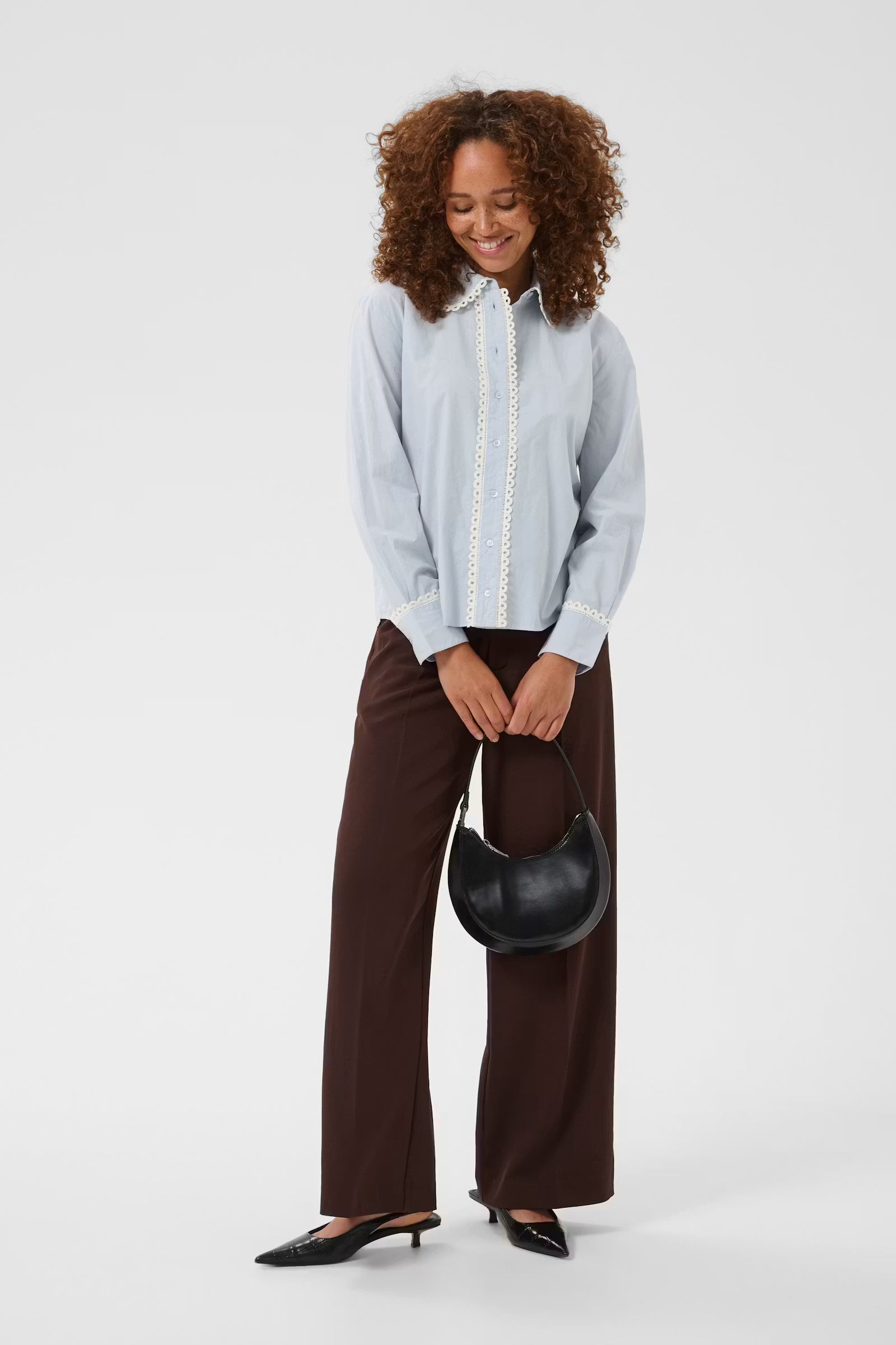 Kaffe Kaketty light blue lace trim shirt styled with brown tailored trousers trend 