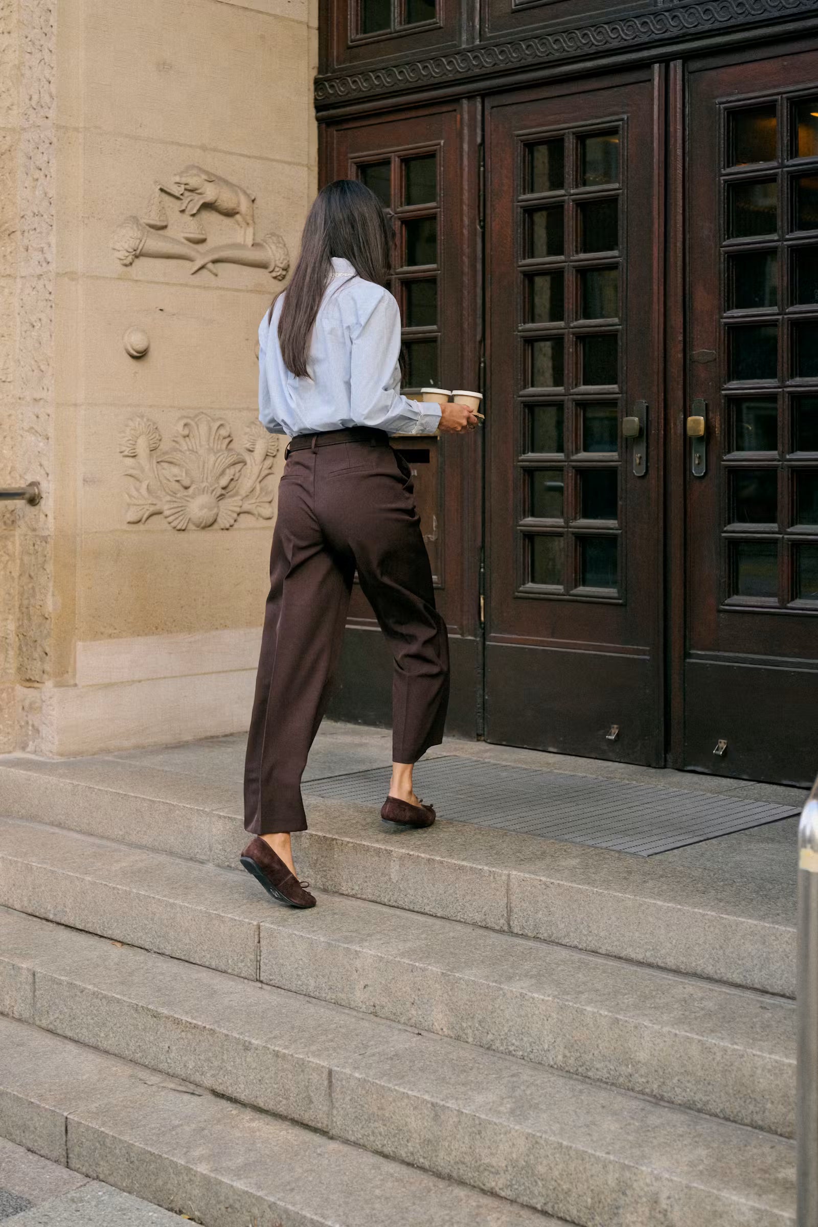 Back view of Kaffe Kaketty Blue Fog lace trim shirt worn with tailored brown  trousers