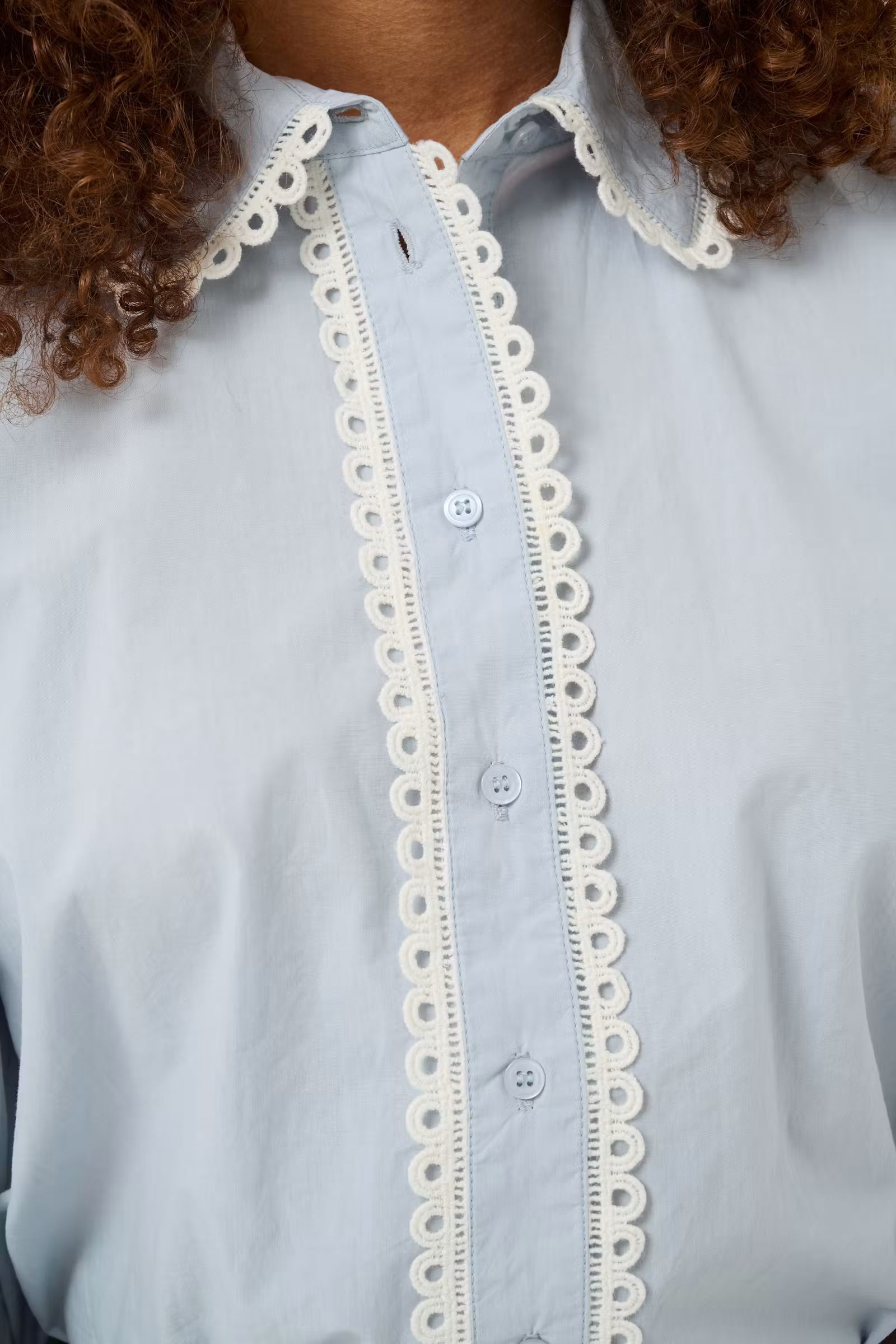 Close-up of Kaffe Kaketty Blue Fog shirt scalloped lace button placket