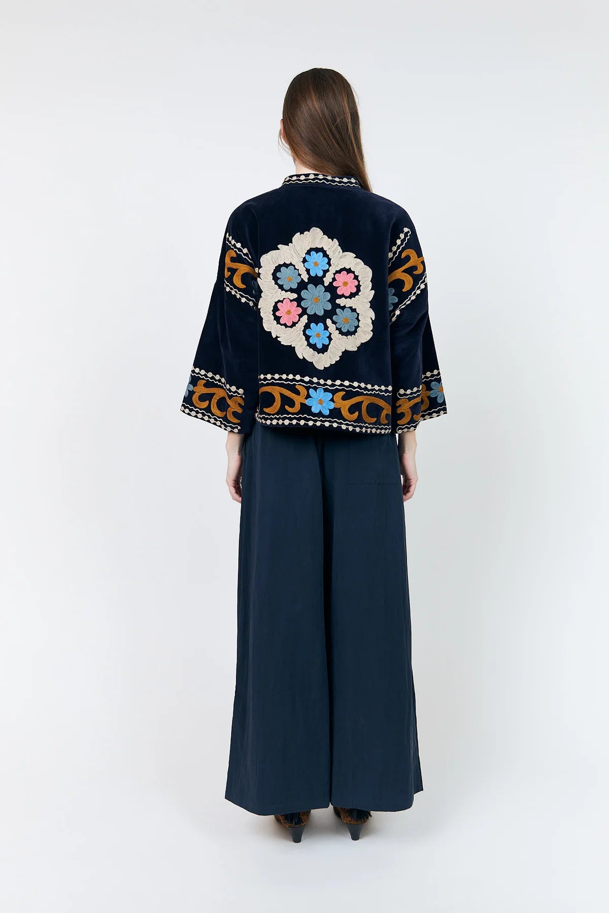 Back view of Lollys Laundry Amby navy embroidered jacket with large floral motif