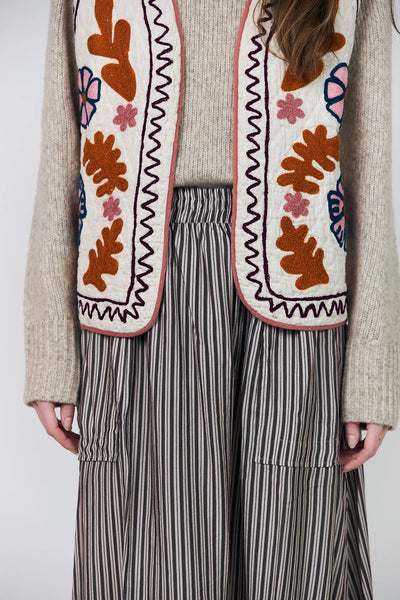 Close-up of Lollys Laundry Honey colourful floral embroidery and contrast edging