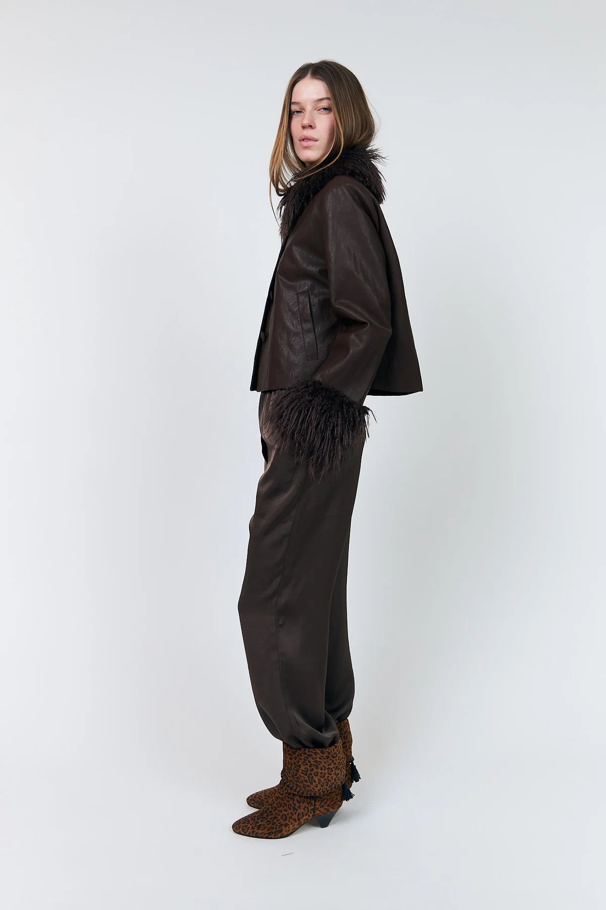 Side view of Lollys Laundry Tracy cropped brown leather-look jacket with faux fur trim