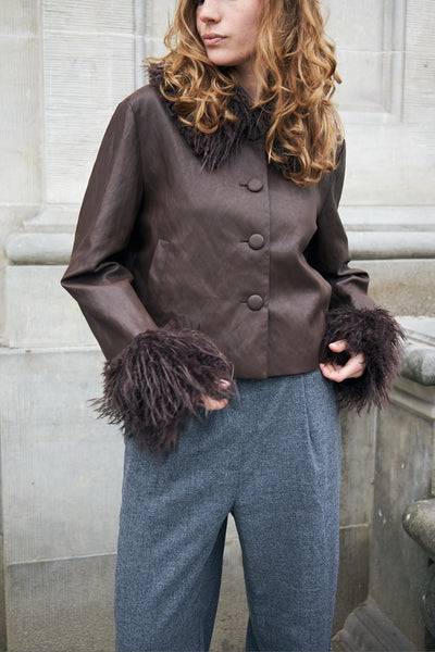 Close-up of Lollys Laundry Tracy brown jacket covered buttons and long-haired faux fur cuffs