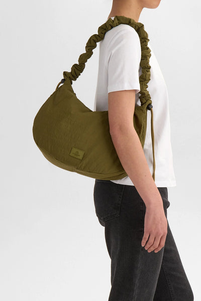 Markberg Ground Ivy Green recycled crossbody bag worn over the shoulder