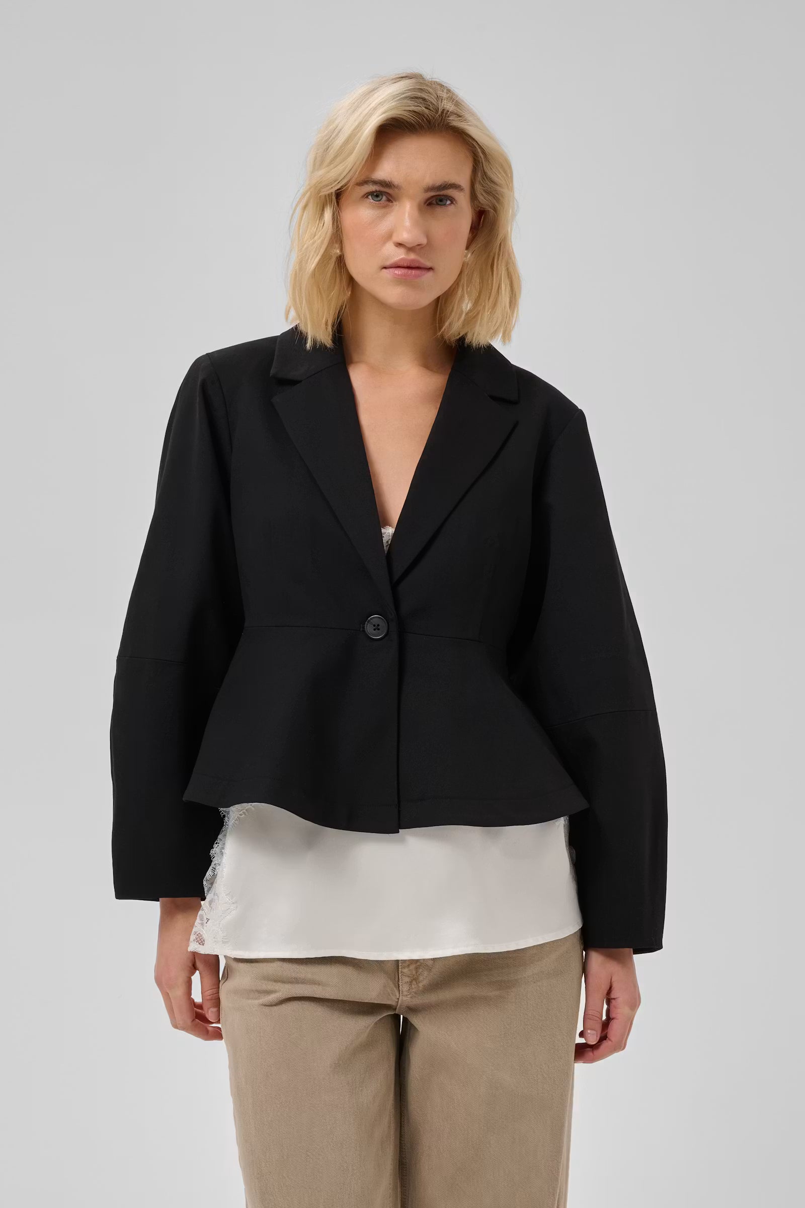 My Essential Wardrobe Evie black cropped blazer front view over a white top