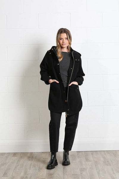 Rant & Rave Joanna black hooded coat styled with black trousers