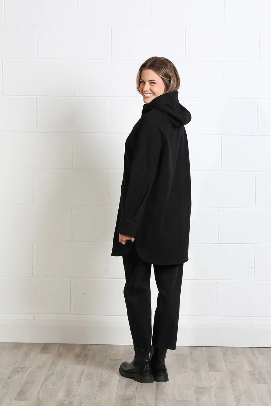 Side view of Rant & Rave Joanna black hooded autumn coat