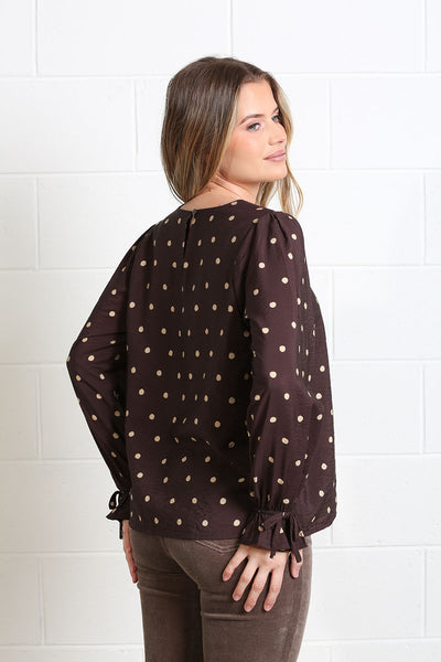 Back view of Rant & Rave Sophia chocolate brown long sleeve polka dot blouse
