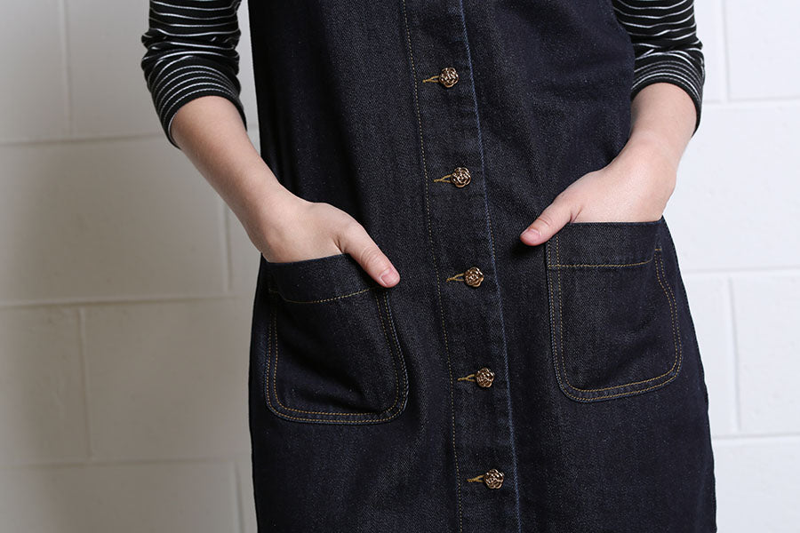 Close-up of Rant & Rave Helena dark indigo denim dress gold-tone buttons and patch pockets
