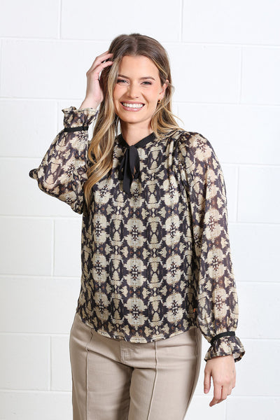 Rant & Rave Maria gold and black geometric print tie neck blouse front view