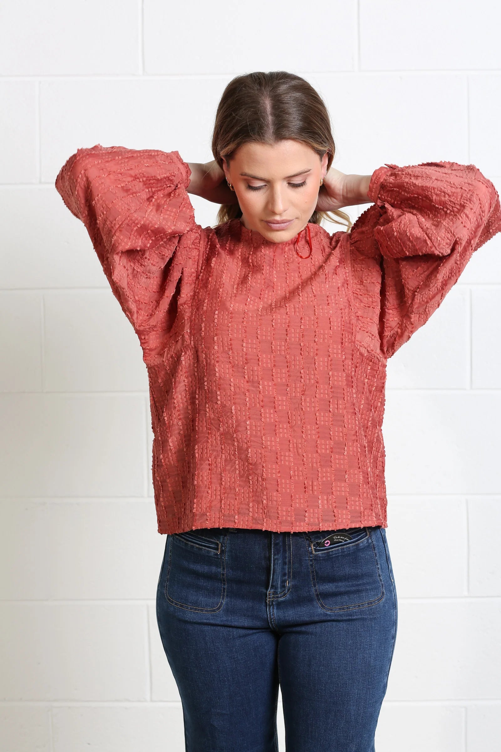 Rant & Rave Zeta terracotta sparkle top styled with brown mini skirt